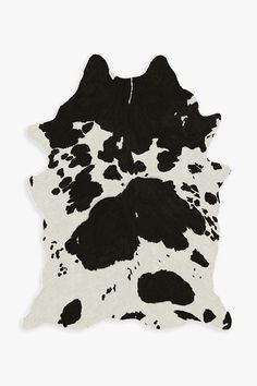 black and white cowhide rug with spots on it's back side, against a white background