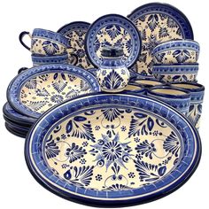 an assortment of blue and white dishes