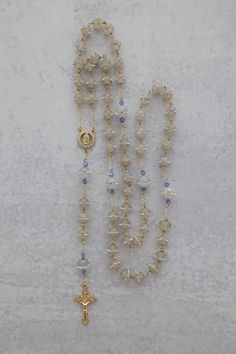 Something Blue Wedding Rosary | 14K Gold Filled with Crystal Beads | Catholic Wedding Gift Add a touch of elegance and tradition to your special day with this stunning Something Blue Wedding Rosary. Crafted with 14K gold-filled details and sparkling crystal beads, this rosary makes a beautiful and meaningful gift for the bride. A perfect keepsake for a Catholic wedding, it features an intricately detailed Virgin Mary centerpiece, symbolizing love, faith, and devotion. Whether for prayer or as a Vintage Catholic Jewelry, Mexican Wedding Traditions, Catholic Wedding Gifts, Wedding Rosary, Rosary Gift, Traditional Catholicism, Rosary Jewelry, Dr Closet, Something Blue Wedding