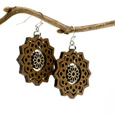 "An intricately cut flower dangles in the center of a mandala to create these boho style earrings. Two tones of wood - walnut and maple - add interest and ensure these earrings will be visible against any hair color. Laser cut wood earrings can be dressed up or down, making them the perfect complement to any outfit! These earrings are strong but so lightweight and comfortable, you will hardly know you have them on! Pair with the matching mandala and flower necklace for a coordinated look: https: Bohemian Brown Flower Jewelry, Brown Flower-shaped Earrings For Gift, Brown Flower Shaped Earrings For Gift, Bohemian Flower-shaped Jewelry With Ear Wire, Bohemian Flower-shaped Pierced Earrings, Bohemian Jewelry With Flower-shaped Matching Earrings, Bohemian Jewelry With Matching Flower-shaped Earrings, Bohemian Single Flower Earring, Traditional Flower-shaped Jewelry With Ear Wire