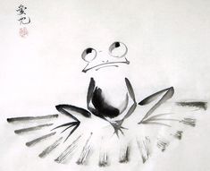 a drawing of a frog sitting on top of a piece of paper with chinese writing