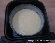 a pan filled with batter sitting on top of a black stove burner oven tray