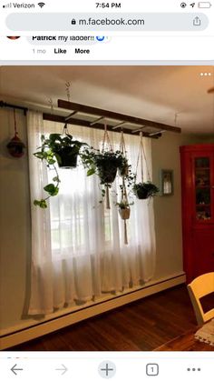 an image of a living room with plants on the window sill