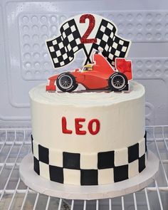 a birthday cake with a racing car on top