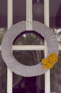 a close up of a wreath on a window sill