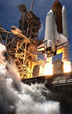 an image of a space shuttle taking off