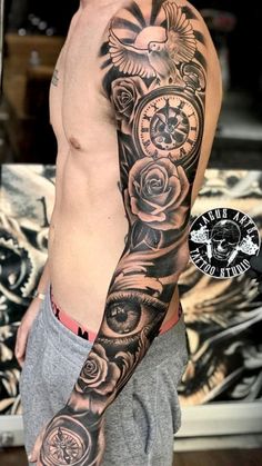 a man with a clock and roses tattoo on his arm is posing for the camera