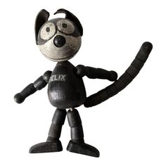 a black and white cat figurine with the word fix written on it