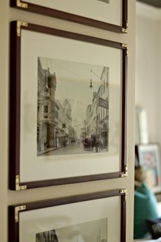 two framed pictures hanging on the wall