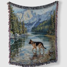 a painting of a german shepherd in the water with mountains and trees behind it, on a wall hanging