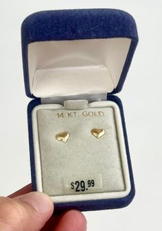 "Vintage 80's solid 14K gold heart stud earrings in original box with original price tag of $29.99 Made in USA Earring backs stamped \"14K\" Width: 1/4\" Height: 3/16\" Good vintage condition NOTE: Please bear that in mind that, when you purchase vintage, it might not be perfect, but it will be authentic.  No returns will be accepted on vintage items so make sure that you read the description and look at the pictures before committing to a purchase.  Please contact me if you have additional ques Classic Gold Heart Earrings For Anniversary, Yellow Gold Heart Earrings For Anniversary On Mother's Day, Yellow Gold Heart Earrings For Mother's Day Anniversary, Yellow Gold Heart Earrings For Anniversary And Mother's Day, Heart-shaped 14k Earrings For Gifts, Heart Shaped 14k Stamped Earrings For Gift, Heart-shaped 14k Stamped Earrings Gift, Gift Heart Shaped 14k Stamped Earrings, Gold Earrings For Birthday, Mother's Day Gift