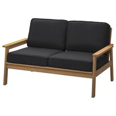 a wooden couch with two black cushions on it's armrests and legs