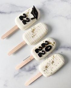 three marshmallows with black numbers on them