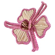 the pink flower is made out of straws