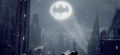 the dark knight rises movie poster with batman and cat on it's back in the city