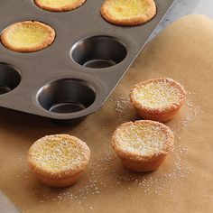 there are some cupcakes that have been placed in a muffin tin