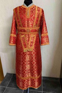 This Sub-deacon style vestment crafted with medium weight liturgical brocade and embellished appliqué embroidered crosses. The basic vestment includes an unseparated robe (stichar) without lining, single or double orarion (option available at checkout).  If you wish to order as a "separated robe" (with ribbon and buttons) for a comfortable fit, please, contact us. The measurements that we need: - Deacon's height - Deacon's circumference of the chest  - Sleeve length  - Clothing size (S, M, L, XL Traditional Brocade Chasuble For Ceremonies, Traditional Brocade Chasuble For Church, Traditional Red Chasuble For Ceremonial Use, Traditional Brocade Chasuble For Ceremonial Use, Vintage Beacon Robe, Luxury Embroidered Red Vestments, Luxury Traditional Embroidered Vestments, Luxury Gold Embroidered Brocade Vestments, Gold Embroidered Brocade Fabric