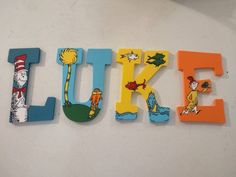 the word luke spelled out with dr seuss and cat in the hat magnets