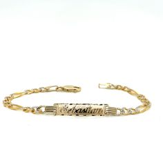 Cherish the Moment with our 14k Yellow Gold Kids ID Bracelet: Crafted in the timeless Solid Figaro style links, this bracelet is a symbol of Elegance and Love. We believe in the power of personalization. Your child's name is expertly cut from solid 14k Gold and elegantly overlaid on the bracelet, creating a one-of-a-kind accessory. Additionally, you have the option to engrave a significant date on the back of the nameplate, transforming this bracelet into a cherished keepsake.  Whether it's a bi Luxury Engraved Oval Link Bracelet, 14k Gold Name Bracelet For Anniversary, Heirloom Yellow Gold Oval Link Bracelets, Heirloom Yellow Gold Oval Link Bracelet, Luxury Adjustable Oval Link Bracelet, 14k White Gold Jubilee Bracelet, Luxury Oval Link Bracelet For Anniversary, Elegant Engraved Oval Link Sterling Silver Bracelet, Luxury Engraved Oval Link Chain Bracelet