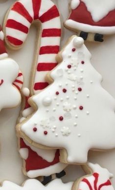 christmas cookies decorated with white and red icing