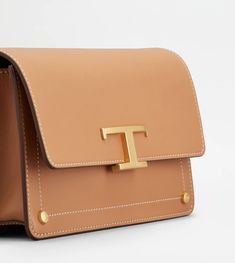 Woman BROWN Shoulder Bag Mini XBWTSIN0100RORPZ9998 | Tods Designer Tan Bag With Detachable Handle, Designer Tan Bags With Detachable Handle, Luxury Tan Crossbody Bags, Top Handle Bags With Brass Hardware For Work, Timeless Top Handle Bag With Metal Hardware, Designer Tan Satchel With Branded Hardware, Leather Tote Flap Bag With Branded Hardware, Designer Tan Flap Bag With Top Handle, Leather Flap Tote Bag With Branded Hardware