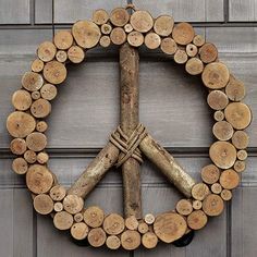 a peace sign made out of wood sticks