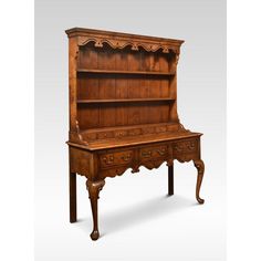 an old fashioned wooden desk with drawers