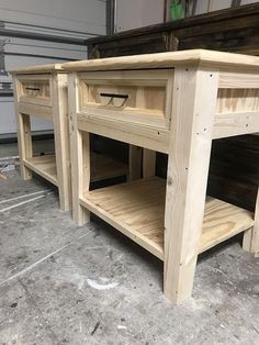 a wooden table with two drawers on the bottom and one drawer open to show what's inside