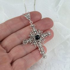 925 Sterling Silver Filigree Art Black Onyx Gemstone Cross Pendant Necklace Silver Chain length is 18.00" + 2.00" extender. Pendant height: 2.30" Pendant width: 1.50" Black Onyx Gemstone is 6 mm, cabochon round cut. Filigree is made of delicate metal strands that have been skillfully fashioned to create an outstanding combination of old and modern art. Originating in Mesopotamia, Anatolia. It is made of delicate metal strands that have been skillfully fashioned to create an outstanding combinati Black Gemstone Necklace For Wedding, Elegant Nickel-free Cross Jewelry, Crucifix Necklace With Intricate Design For Gifts, Intricate Crucifix Necklace As A Gift, Intricate Crucifix Necklace For Gift, Elegant Black Jewelry With Intricate Design, Ornate Black Sterling Silver Jewelry, Black Engraved Pendant Jewelry, Black Crucifix Necklace Engraved