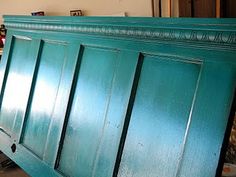 an old door as headboard, just add crown molding and paint awesome idea