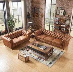 a living room with two couches and a coffee table in front of large windows