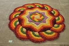 there is a colorful flower design on the ground