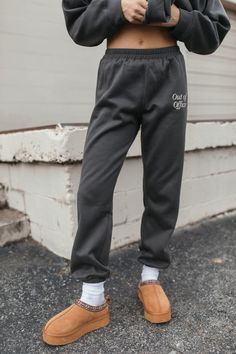 The Out of Office Set includes a hoodie with a kangaroo pocket & "Out of Office Graphic" on the front, and joggers with an elastic waist & ankles, pockets & an "Out of Office" graphic on the thigh. Self: 94% Polyester, 6% Cotton Contrast: 65% Polyester, 35% Cotton Hand Wash Cold, Hang Dry Casual Sweatpants With Kangaroo Pocket For Loungewear, Cotton Sweatpants With Kangaroo Pocket For Loungewear, Gray Casual Sweatpants With Letter Print, Casual Gray Sweatpants With Letter Print, Casual Sweatpants With Kangaroo Pocket For Streetwear, Urban Joggers With Letter Print For Loungewear, Casual Letter Print Joggers For Loungewear, Cozy Joggers With Elastic Waistband For Streetwear, Winter Leisure Joggers With Side Pockets