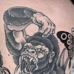 a close up of a person's thigh with tattoos on it and a lion