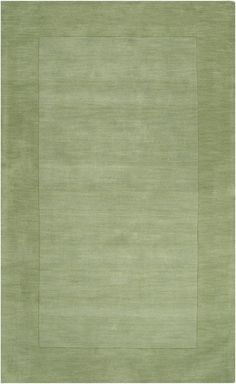 an area rug with a square design in green