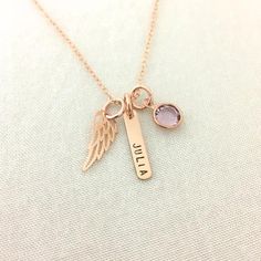 Rose Gold Baby Memorial Necklace, Loss of Infant Jewelry, Angel Wing, Stillborn Gift, Mother of An Angel, Name Necklace, Bar JewelryAvailable in silver, gold and rose gold.This necklace can be personalised with any word or name ( max. 8 letters ). Please drop the word in the note box at checkout.Specification. Chain and findings are Sterling Silver or 14K Gold Filled or 14K Rose Gold Filled. Angel wing is Sterling Silver or Bronze or Rose Gold Vermeil size 6 x 14.3mm. Bar size 16 x 3.2mm. Disc s Personalized Pink Jewelry For Keepsake, Rose Gold Charm Necklaces For Birthday, Rose Gold Charms Necklace For Birthday, Rose Gold Charms Jewelry For Birthday, Mother's Day Engraved Pink Jewelry, Rose Gold Jewelry With Charms For Birthday, Mother Of An Angel, Infant Jewelry, Angel Name