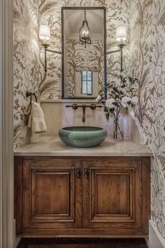 a bathroom vanity with a green bowl sink