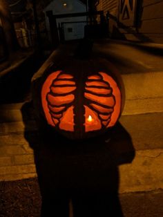 a pumpkin carved to look like a skeleton