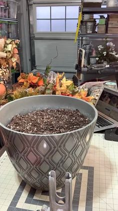 a large metal bowl sitting on top of a counter