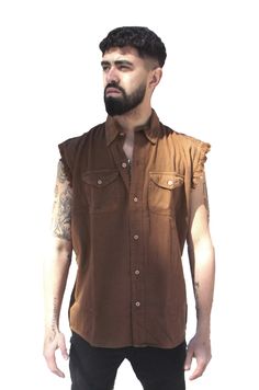 Shipping is FREE! We offer a Cut off Sleeveless Chocolate denim shirt Size Medium. Great, hard to find, dark brown color. We can not get any more of this color. Frayed cut off sleeves Snap down collar with the snaps concealed for a clean spread collar look Two flap chest pockets with button closure Double stitching throughout Great layering item, Long enough to wear over other shirts and still looks casual and comfortable. Wear it as a shirt or get it over sized to wear as a vest over a sweat sh Motorcycle Shirts, Denim Shirt Outfit, Biker Shirts, People Clothes, Mens Cuts, Vest Shirt, Slim Fit Shirt, Denim Shirt, Mens Clothing Styles