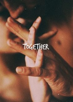 two hands touching each other with the words together in white letters on top of them