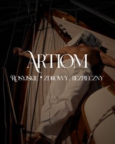 a man laying on top of a boat next to the words artiom written in white