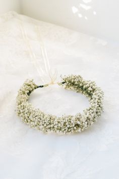 Our Baby's Breath flower crown is a beautiful dried flower crown that compliments well with classic, vintage, rustic, farm, boho, garden, and forest inspired themes and would be absolutely beautiful for any kind of wedding! Nothing beats classic baby's breath.  * Made with real dried baby's breath. Tied with ivory satin ribbon.  * This flower crown will last for years, so you can keep your precious memories from your special day or gift them to your loved ones.  * We make one standard size crown Flower Girls Headband, Real Flower Crown, Bridal Flower Crown Boho, Roses Crown, Bud Vases Arrangements, Flower Crown Flower Girl, Baby Breath Flower Crown, Flower Toss, Dried Flower Crown