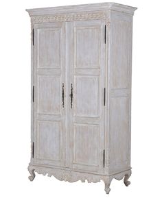 an antique white armoire with ornate carvings on the top and bottom, against a white background