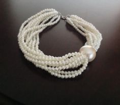 I designed this very romantic necklace with big size imitation pearl and small ivory pearls It is boho chic design and also vintage inspired work For something unique to yourself, mix and match the piece with other items in your jewelry collection. It is beautiful,stylish,elegant wedding accessory! You can wear it for your special evenings,night out,graduations,birthdays.... White Pearl Necklace For Bridal Shower, White Pearl Bridal Necklace For Bridal Shower, White Pearl Chain Bridal Necklace For Bridesmaid, White Pearl Chain Necklace For Bridesmaid, Elegant Handmade Cream Pearl Necklace, Handmade Cream Pearl Necklace For Wedding, Bridesmaid Gift White Pearl Chain Bridal Necklace, White Pearl Drop Bridal Necklace For Bridesmaid Gift, White Pearl Drop Necklace For Bridesmaid Gift