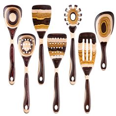 six wooden spatulas with different designs on them