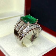 BRAND-NEW!! ONE OF A KIND, HANDCRAFTED RING. EXQUISITE AND FINE CRAFTSMANSHIP! HANDMADE TO LAST FOR AN ETERNITY!! HEIRLOOM PIECE!! PRECIOUS JEWELRY TO BE PASSED ON! PERFECT DRESS RING FOR A GENTLEMAN OR A LADY! 5.04 total carat weight, Certified, Natural emerald ring. This ring offers an important statement of who you are with a 2.88 carats, VIVID DARK GREEN, transparent, ZAMBIAN EMERALD. Accentuating the EMERALD are the 48 SUBSTANTIAL E/VS, sparkling natural diamonds SUGGESTED RETAIL VALUE: $15 Luxury Green Emerald Ring With Diamond Cut, Fine Jewelry Tsavorite Diamond Ring For Formal Occasions, Luxury Tsavorite Emerald Ring For Formal Occasions, Luxury Green Emerald Ring For Formal Occasions, Luxury Diamond-cut Emerald Ring For Formal Occasions, Luxury Emerald Ring With Diamond Cut For Formal Events, Luxury Emerald Ring With Diamond Cut For Formal Occasions, Luxury Green Diamond Ring In Platinum, Formal Emerald Diamond Ring With Vvs Clarity