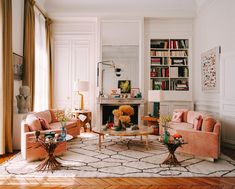 a living room with two couches and a coffee table in the middle of it