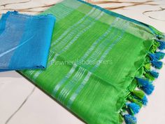 Linen sarees are always in demand.This Green linen saree with  silver zari border give you a unique style.The saree comes with blue blouse piece.Linen sarees are breathable,light weight and easy to drape. Fabric: Linen by linen  Thread count:100 count Saree Color: Green with blue Occasion: Casual/Formal Saree length:5.50 mtr Blouse:80 cm Custom Stitching: Available upon request Saree Embroidery: Available upon request Blouse Stitching: Available upon request Shipping: 7 to 10 business days Note: Green Slub Silk Saree With Weaving Work, Drape Fabric, Zari Saree, Formal Saree, Blouse Stitching, Linen Thread, Green With Blue, Linen Sarees, Saree Embroidery