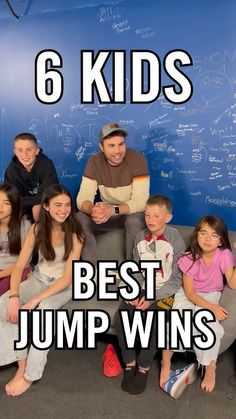 a group of kids sitting in front of a chalkboard with the words 6 kids best jump wins